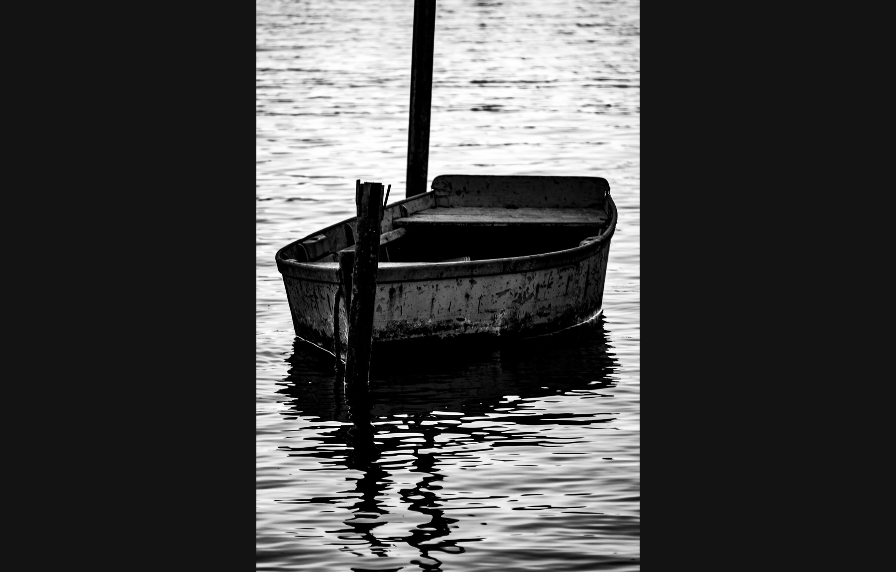 Boat reflected in quiet water